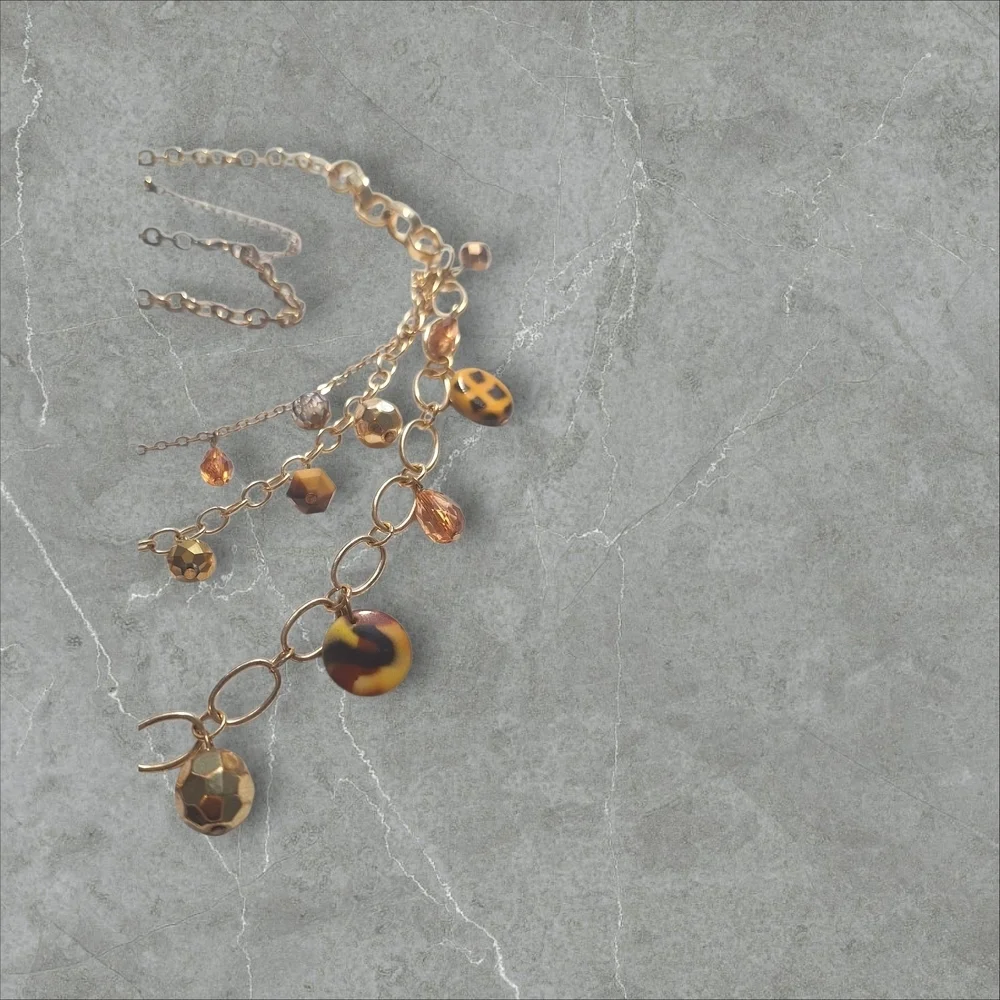 Gold and Brown Nature-Inspired Necklace with Crystal Accents